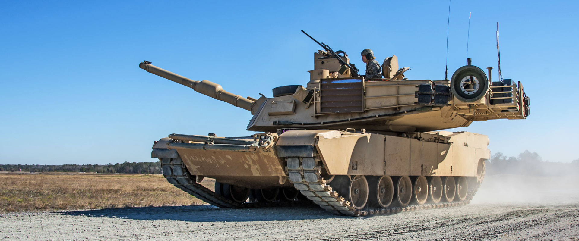 An image of a battle tank on the move.
