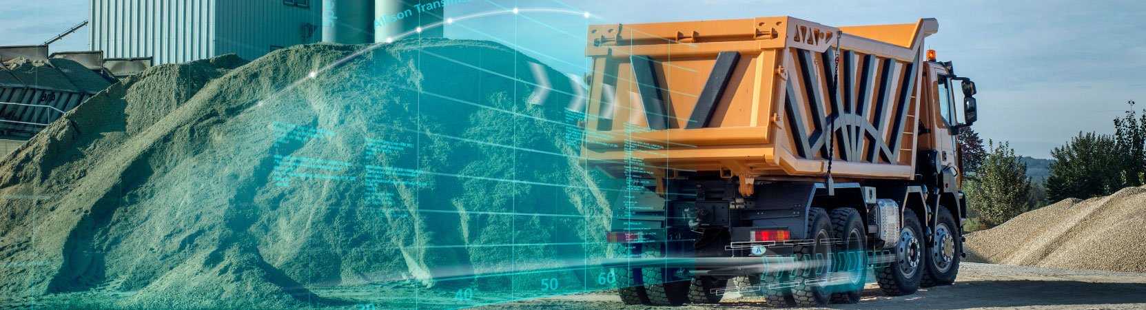 An orange dump truck travels on a gravel path near in an aggregate facility. Blue lines and shading shoot from the back of the dump truck to show movement.